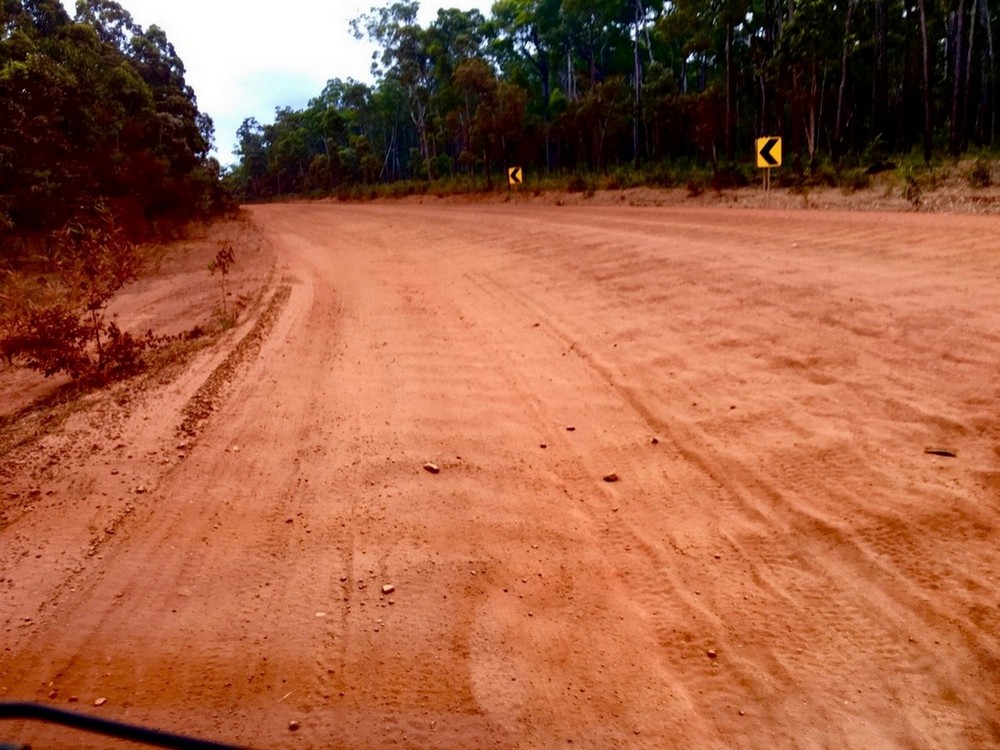 red dirt road with corrugations