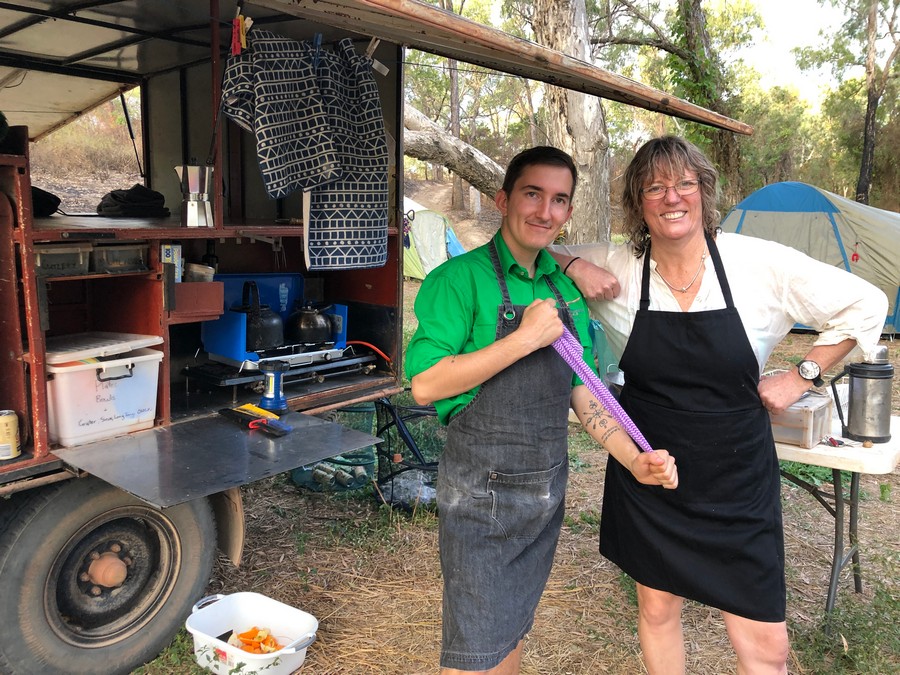 chef with lady in camp kitchen smiling