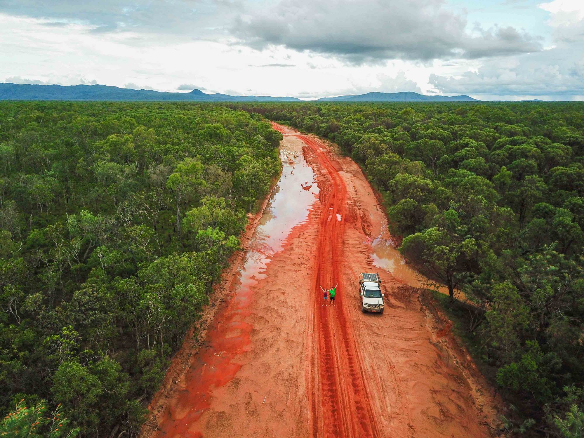wet red dirt road in cape york