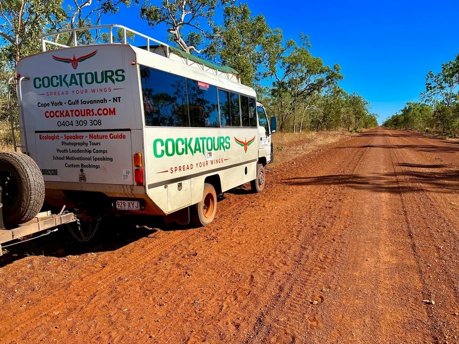 cockatours tour truck on red dirt road