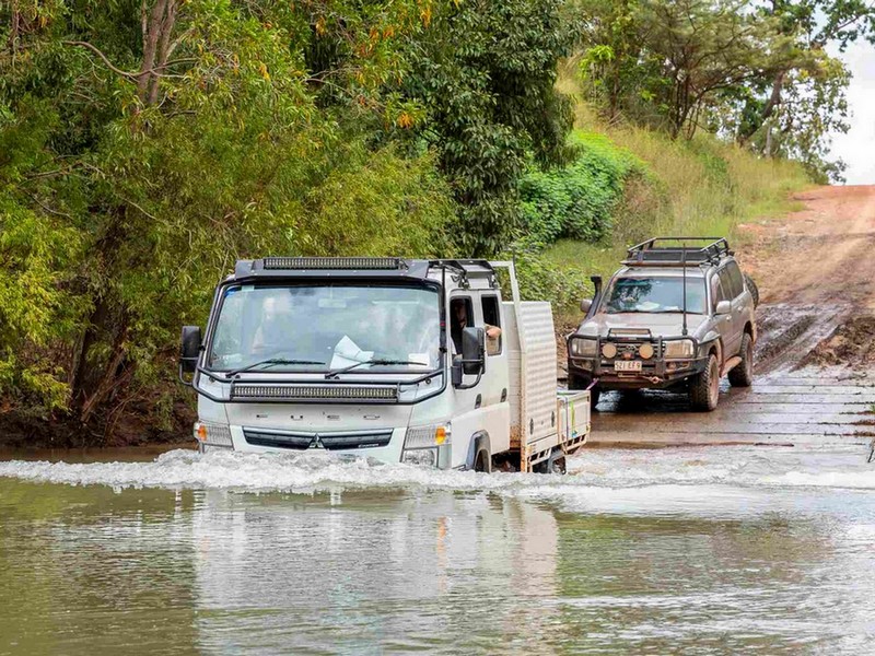 4wd vehicles crossing deep river