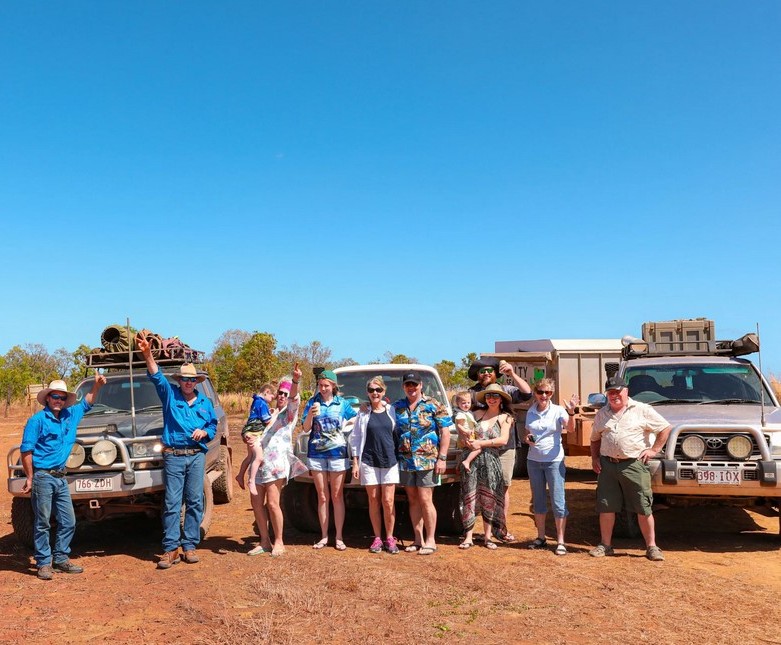 people in front of 4wd vehicles
