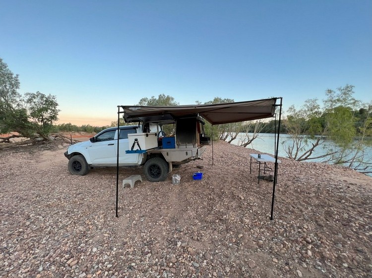 4wd ute with awning out beside river
