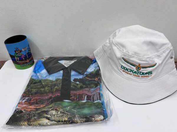 a shirt, cap and drink cooler